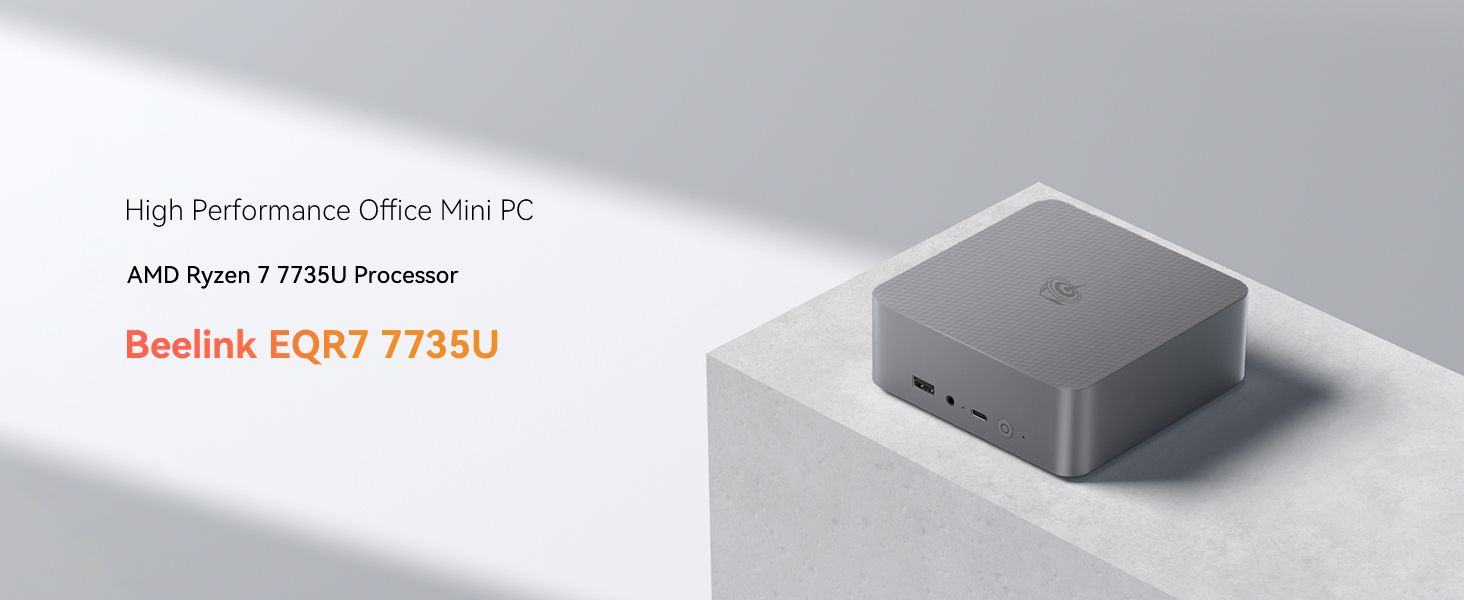 Le texte indique « Beelink EQ67 7735U ». Mini-PC ou appareil informatique de petit format présenté en finition métallique grise sous plusieurs angles.